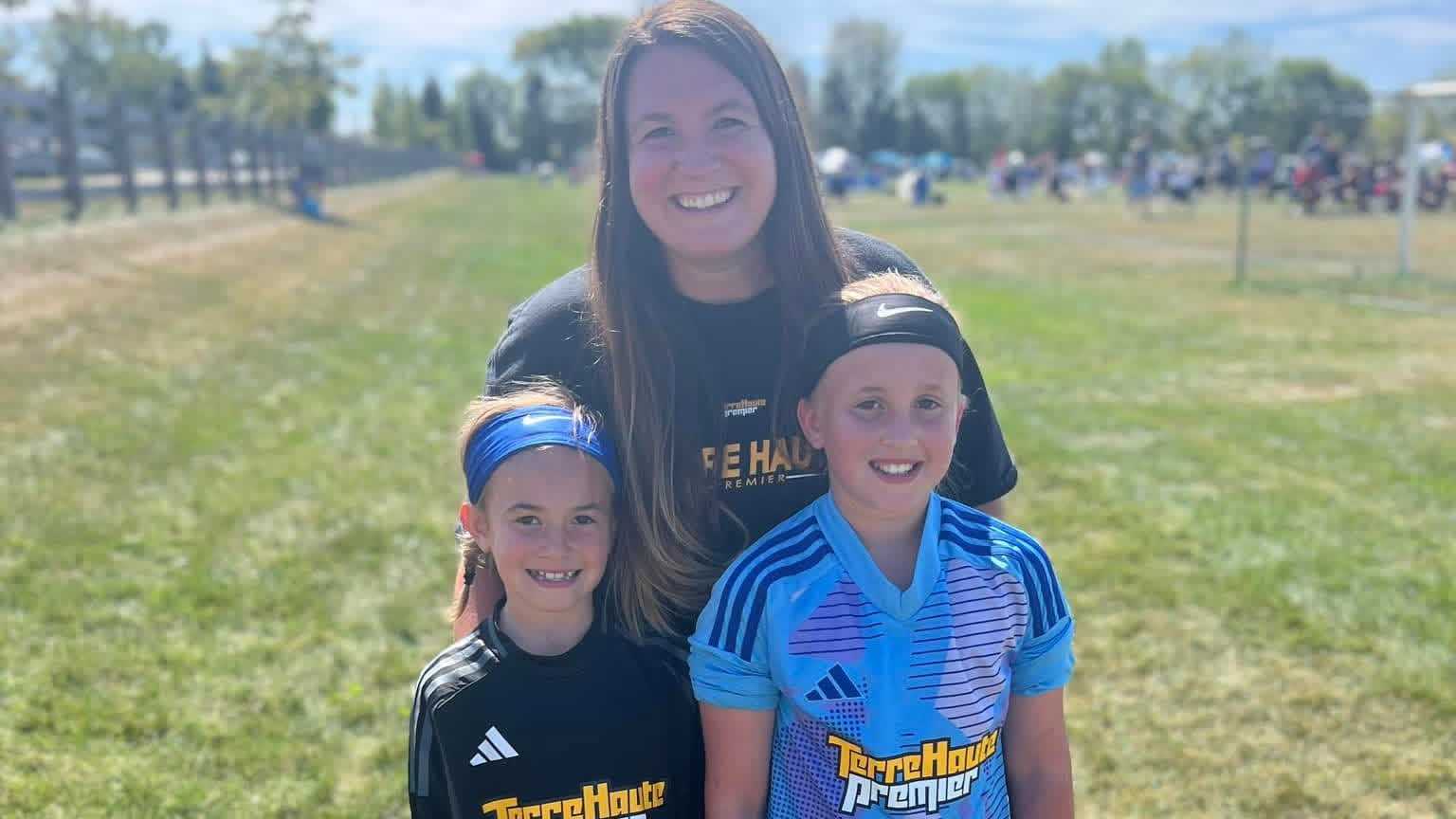 Tara Counterman with her two daughters in their soccer uniforms at a tournament