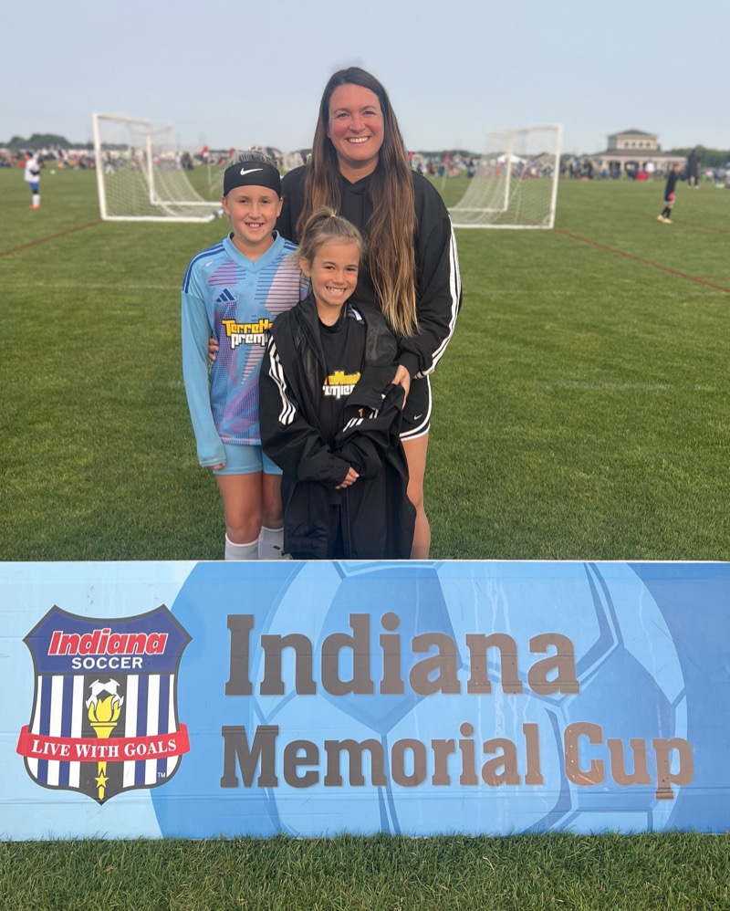 Tara with her daughters in their sports gear